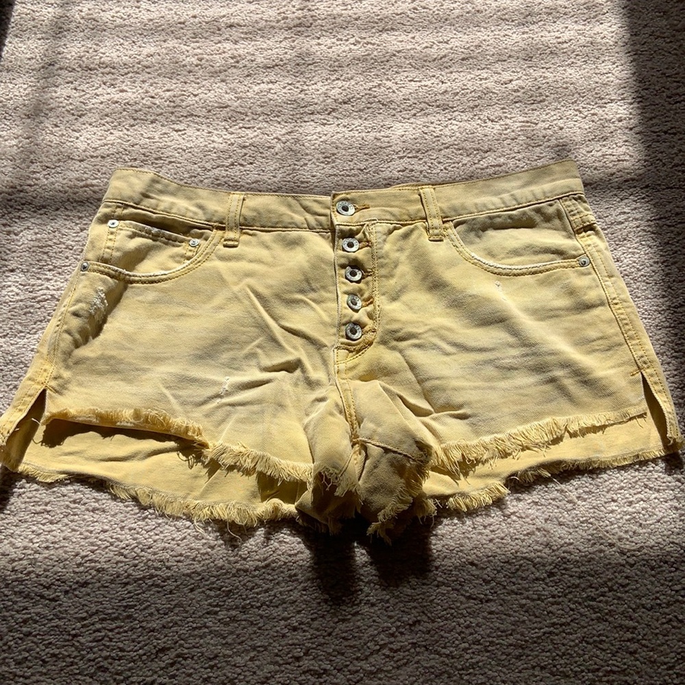 Free people yellow denim shorts. Distressed. Size 29.